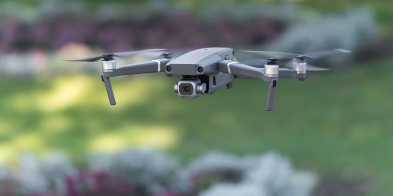 Drone like Mavic 2 Pro flying during the day in field of flowers Avocat Drone civil