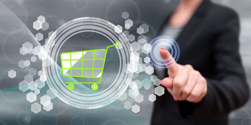 Woman touching an e-commerce concept Avocat Distribution et Plateforme en ligne